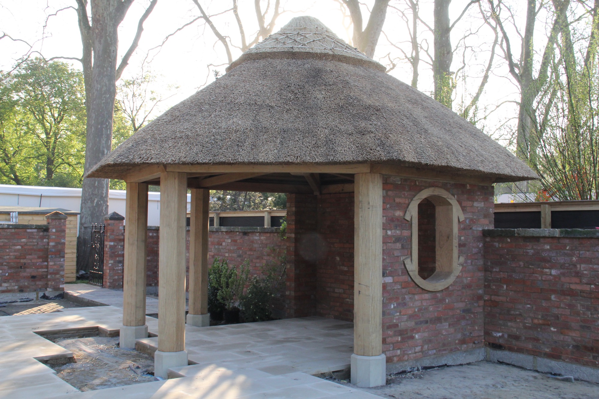oak summer house with thatched roof, manufacture, supply and installation. This one for The RHS Chelsea Flower Show