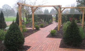 garden pergola made from wood. constructed in the traditional manner using oak dowels and installed on site by our team of landscapers. Bespoke hand-crafted oak pergolas to fit different sizes and spaces